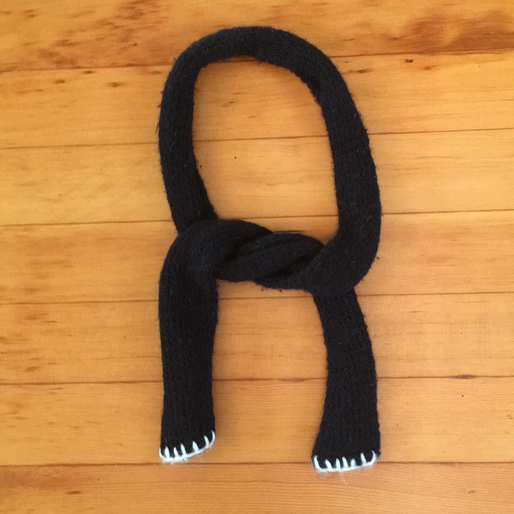 Black wool scarf with white wool trim